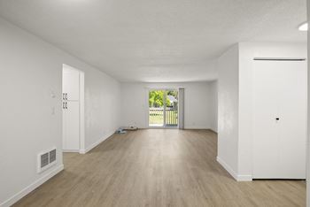 a bedroom with hardwood floors and white walls at Chalet, Springfield, Oregon
